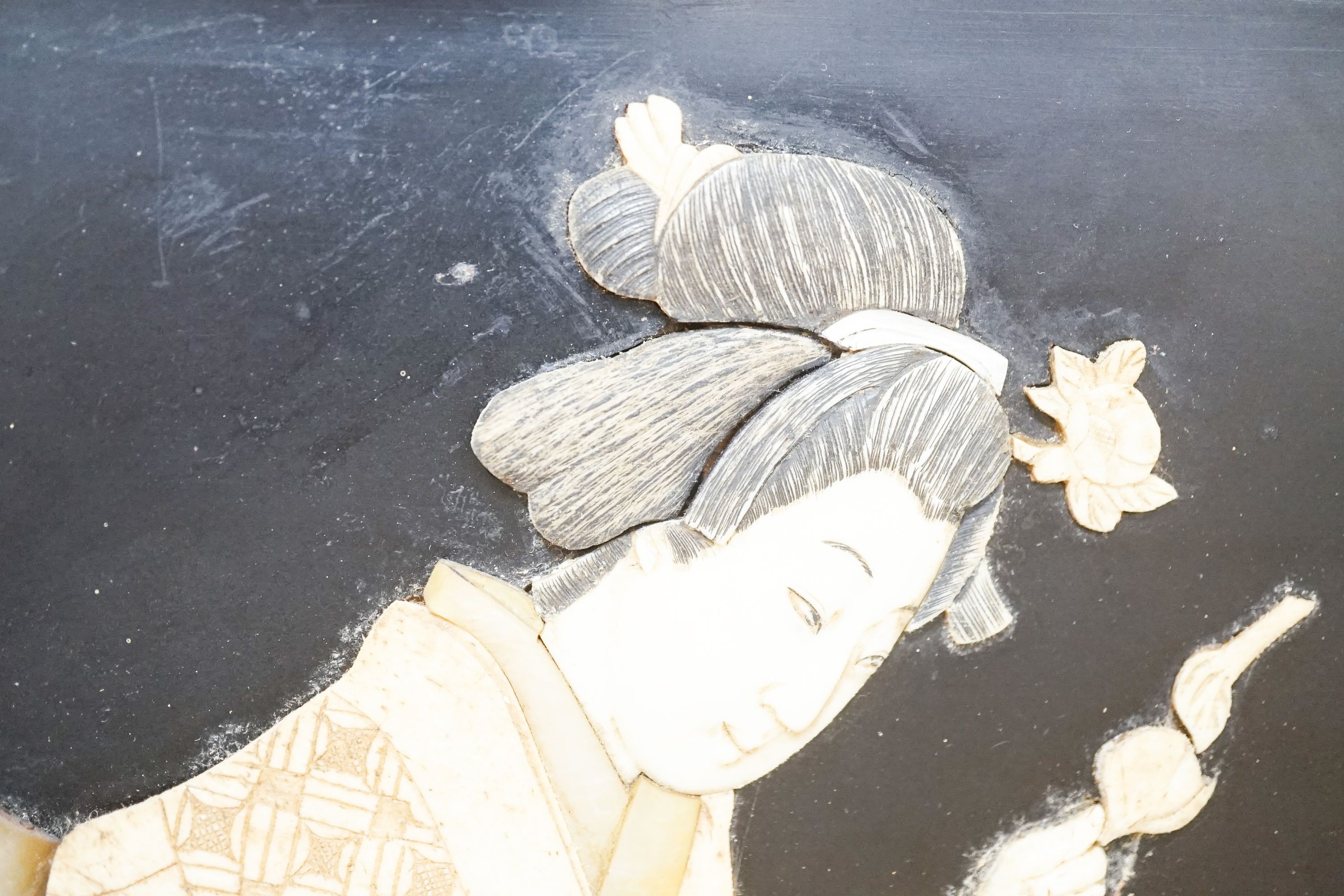 A pair of Japanese Shibayama style ivory, bone and mother of pearl inlaid lacquer panels, Meiji period, depicting two seated men, the other a bijin, 30 x 45cm